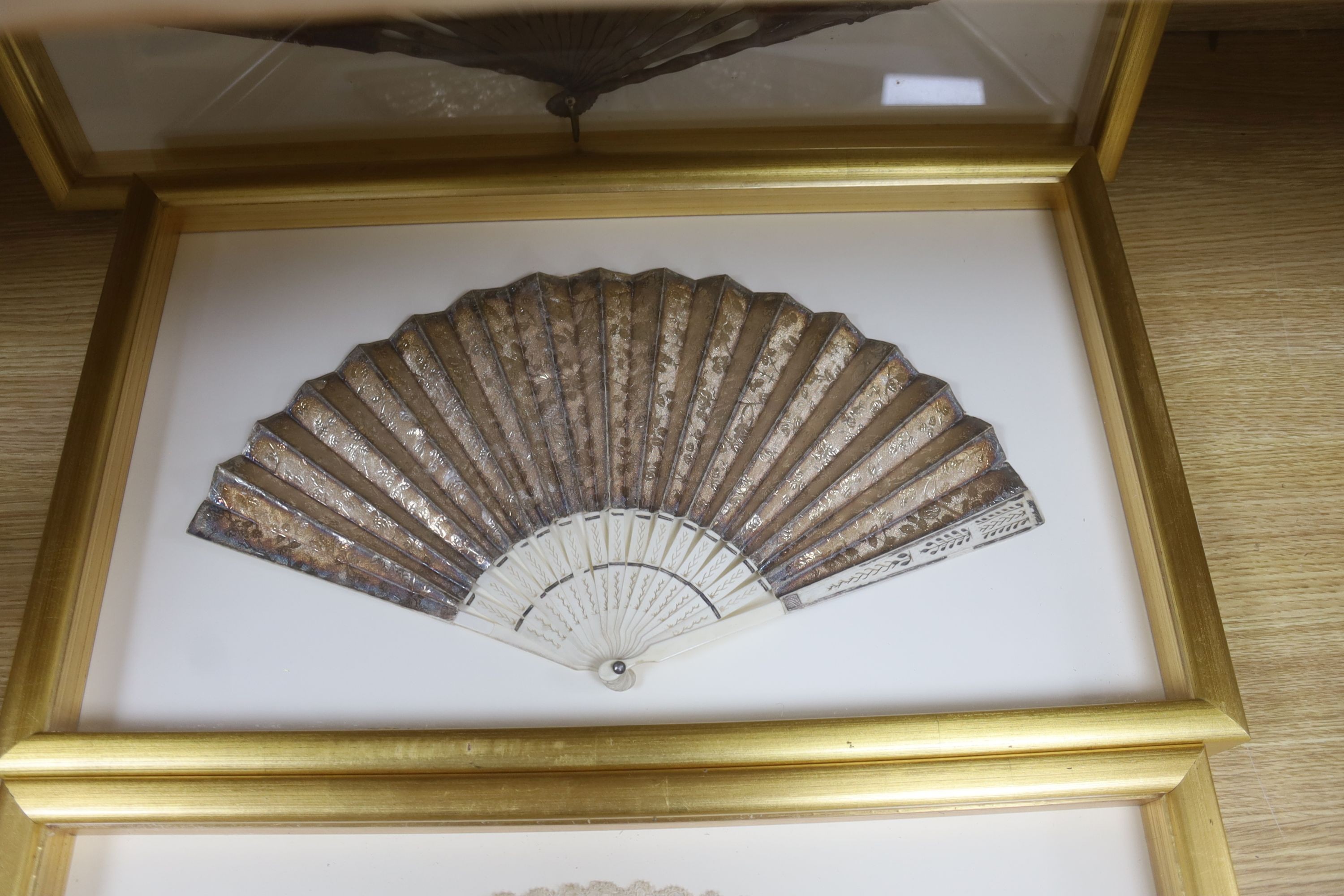 Two 19th century lace edged hand painted fans and a gilt and ivory fan, in 3 cases, largest case 42 x 67 cm